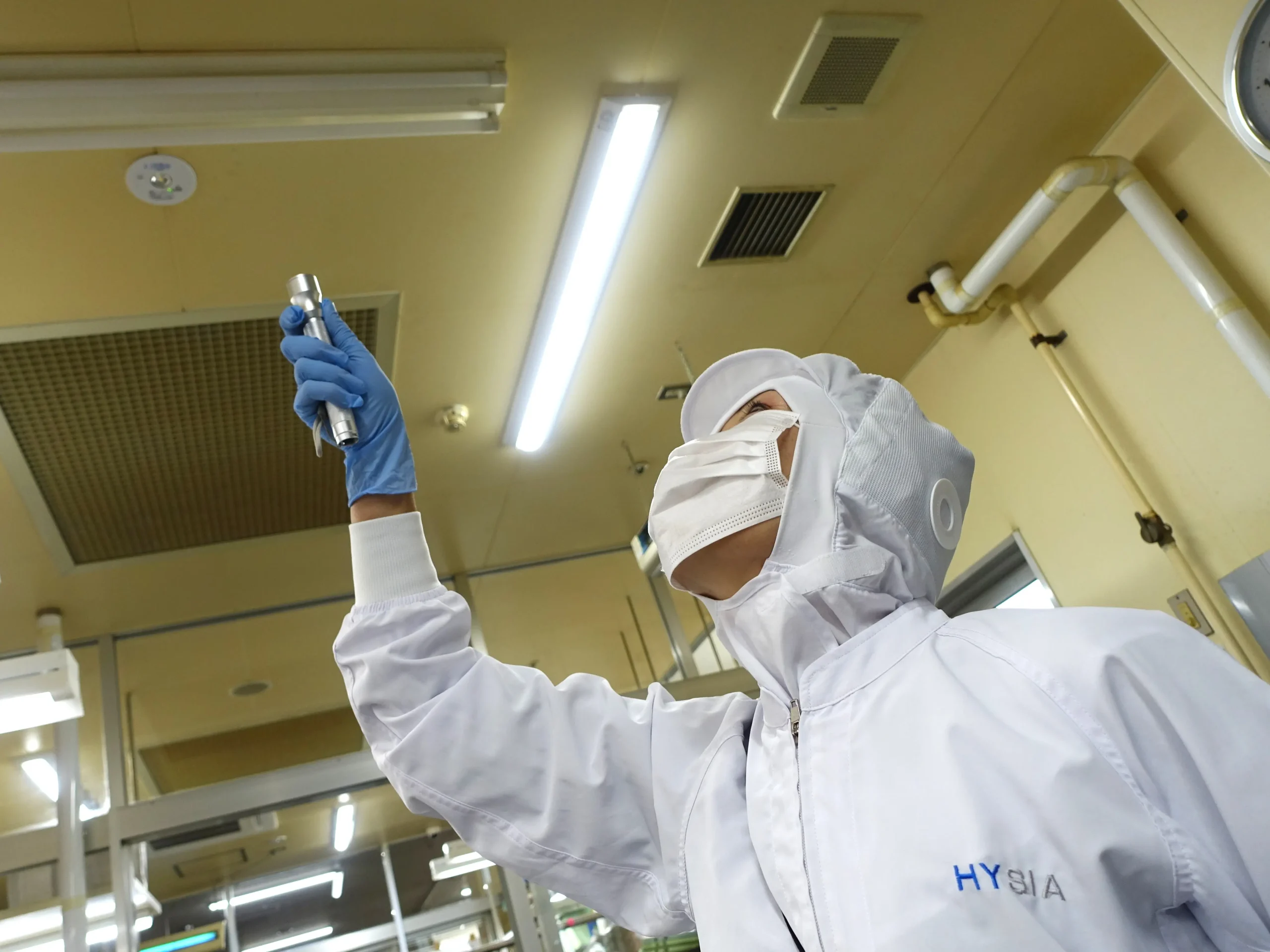 HYSIA professional performing hygiene audit with checklist in food processing facility